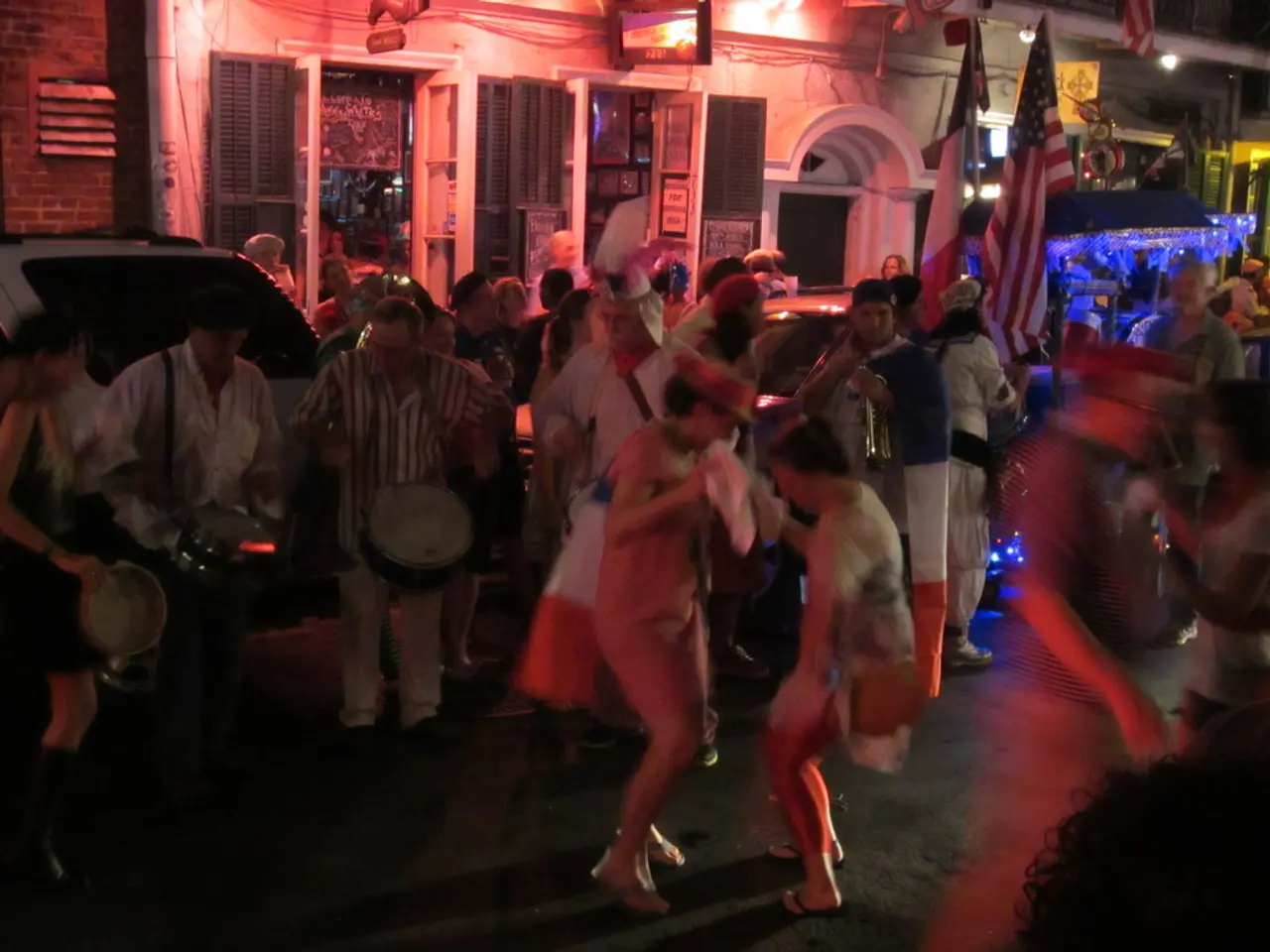 Individual perform dance atop vehicle, subsequently departing towards the sunset.