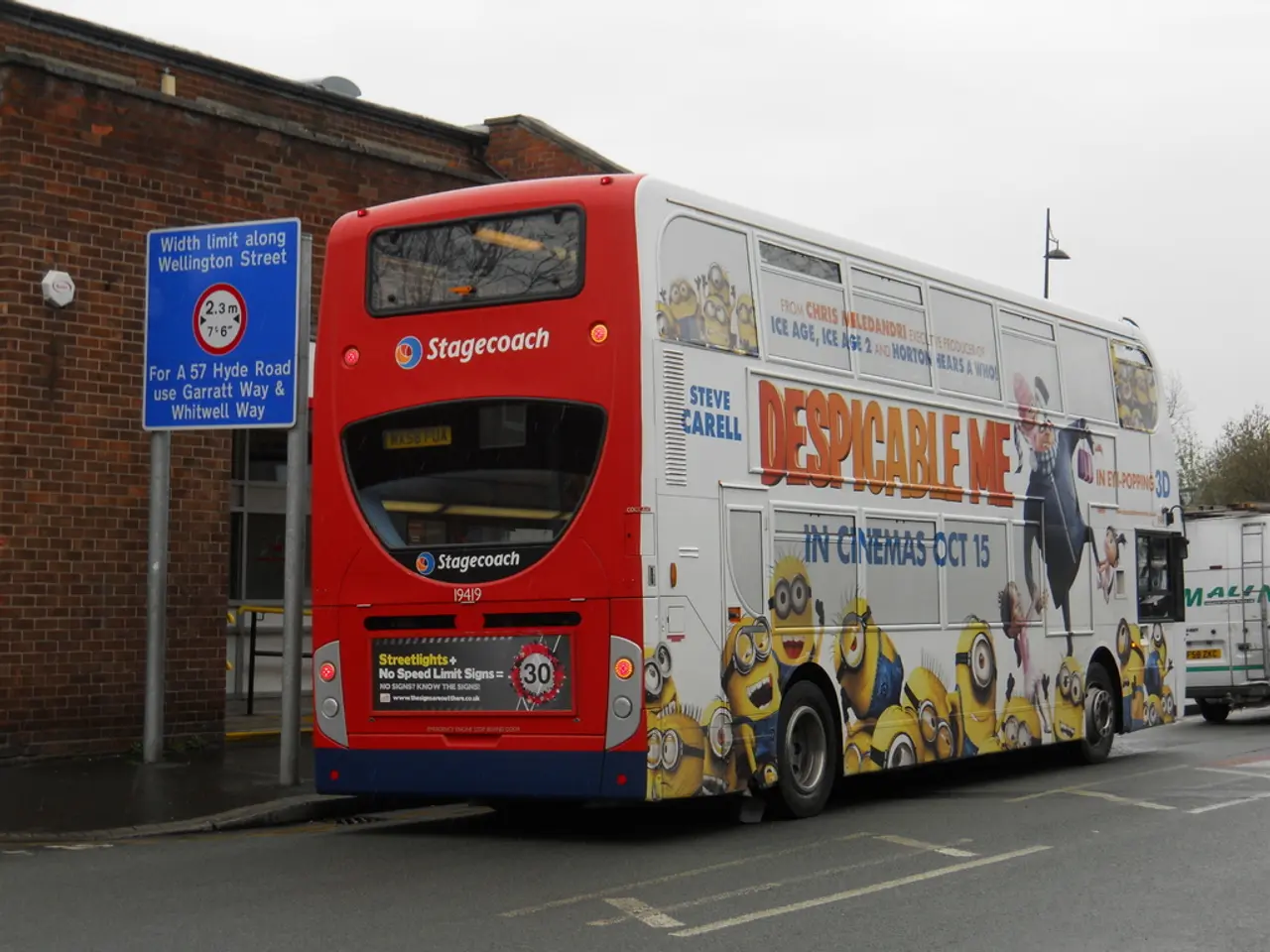 In this picture there is a white and red color bus is parked on the road. Behind there is a red...