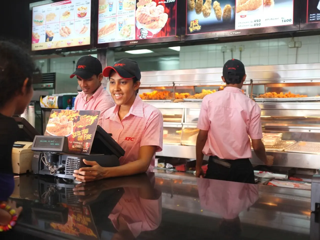 In this picture I can see the three persons are standing in the middle, on the left side there are...