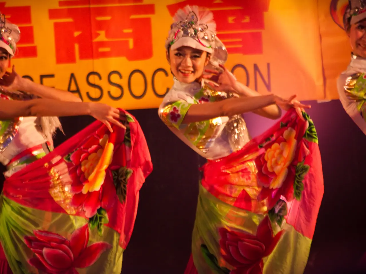 In this image, we can see some girls performing dance.