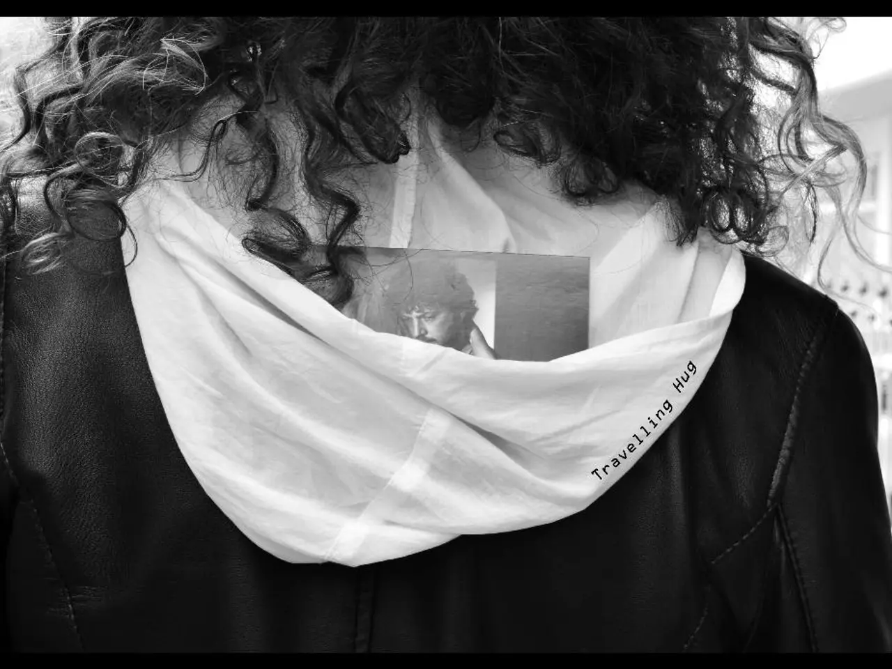 In this image we can see a person wearing a jacket.