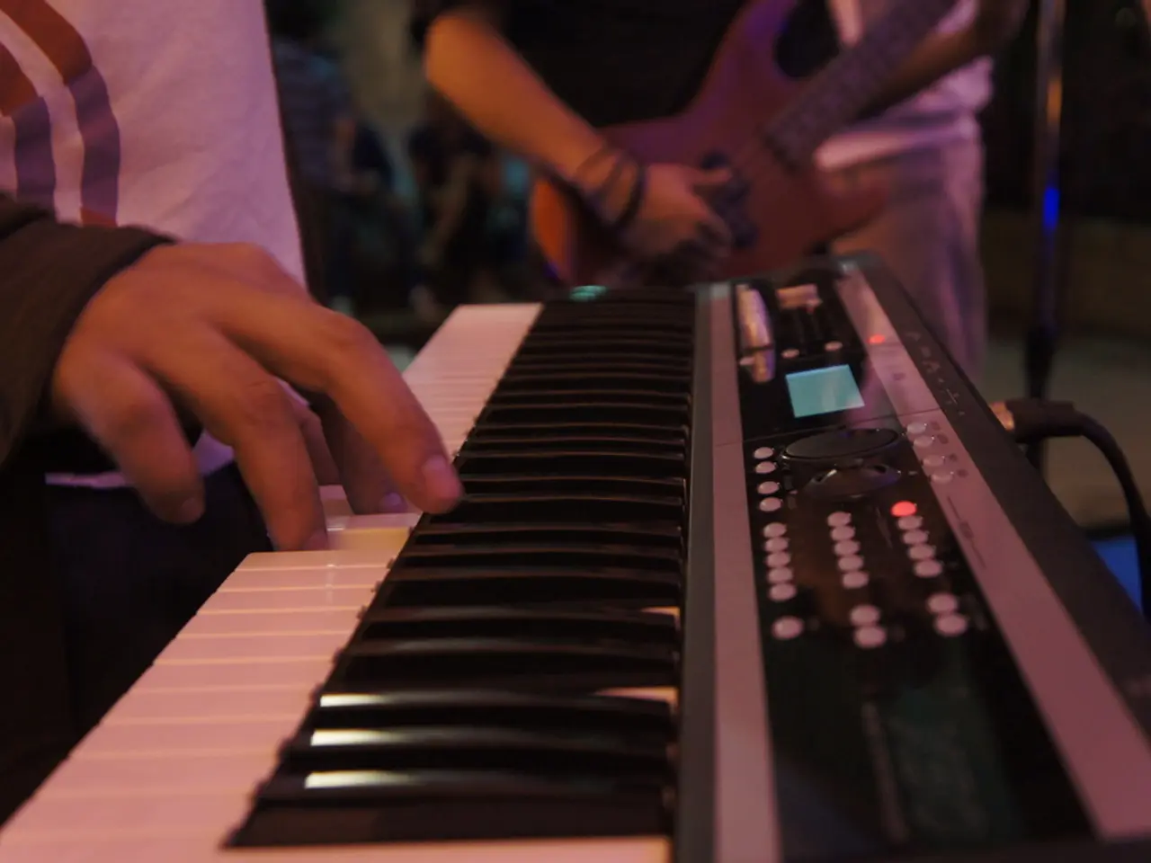 In the image we can see there is a person who is playing casio.