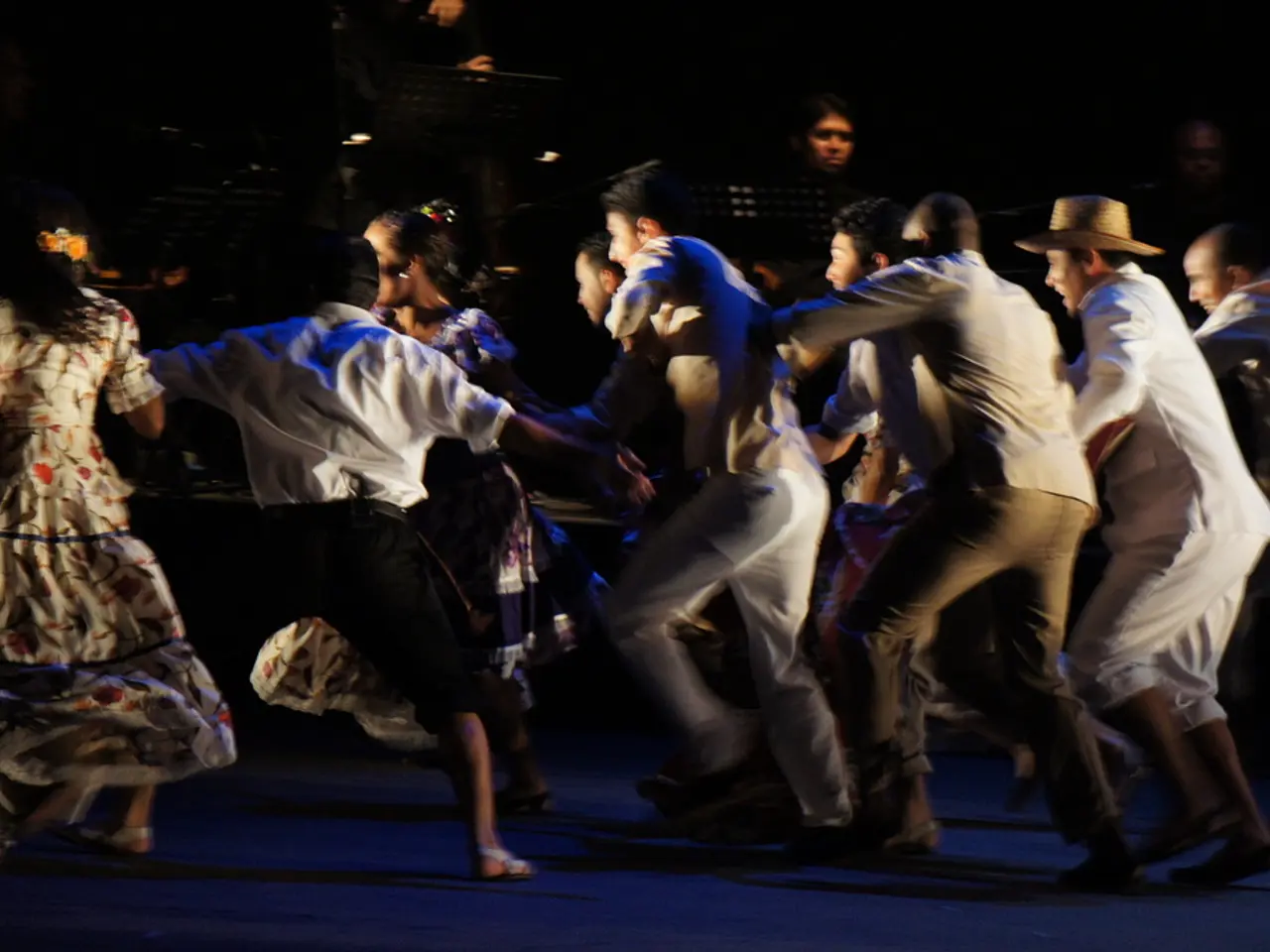 In this picture there are group of people dancing. At the back there are group of people and there...