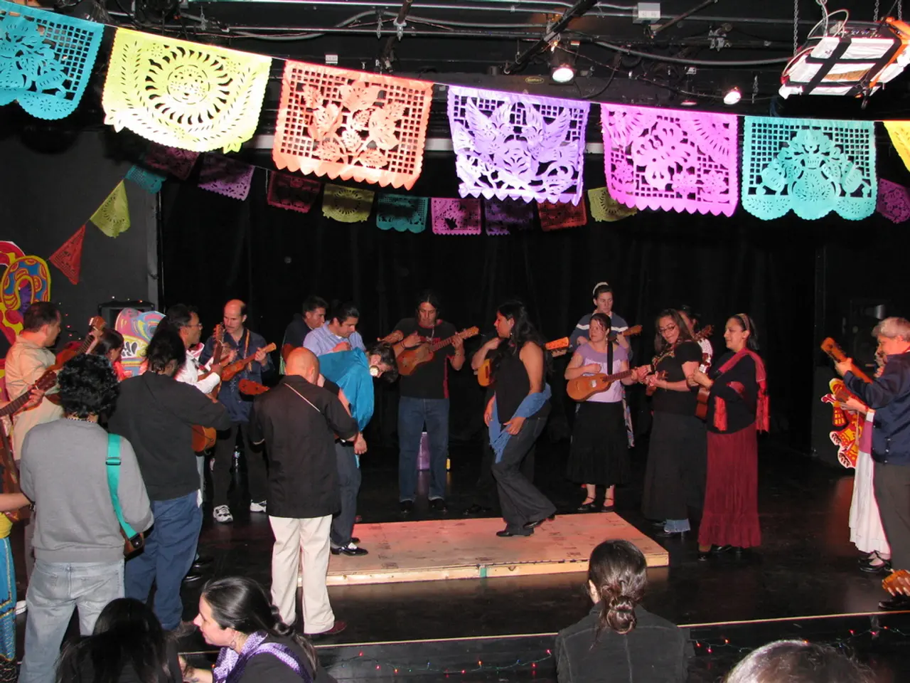 In the center of the image we can see people standing and playing musical instruments. At the top...