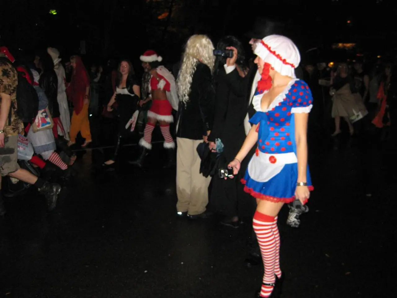 In this image there are a group of people walking on the floor, in which some are wearing drama...