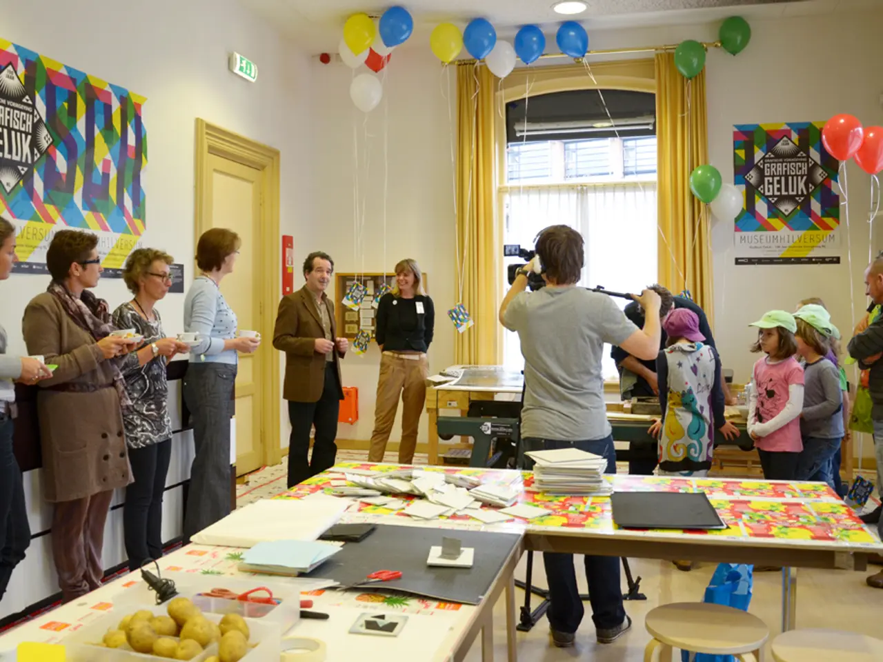 This picture is taken inside a room. It looks like a celebration. There are people in the room....