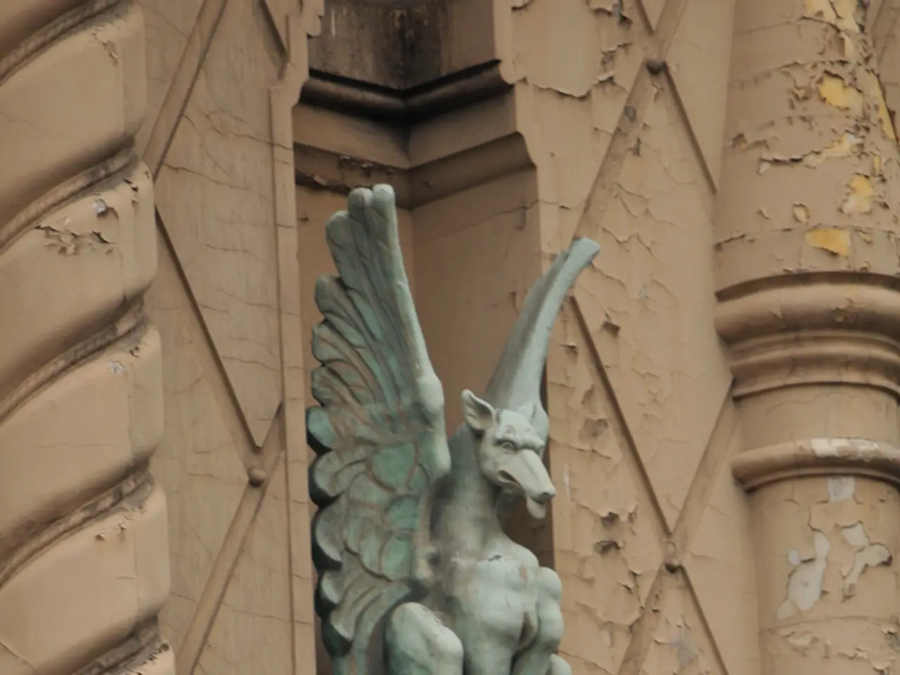 There is a depiction of a dragon in the middle of this image. There are some leaves of a tree at...