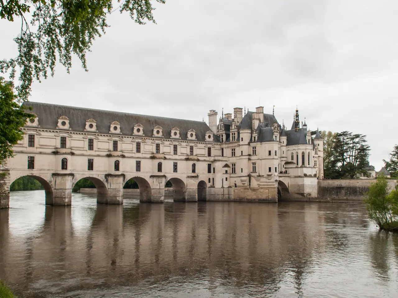 In this image there is a castle on the water. At the bottom there is the water. At the top there is...