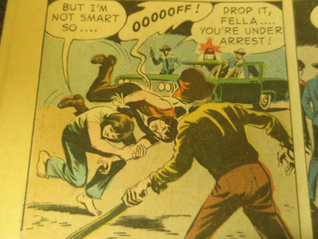 In this image we can see a paper of a comic where we can see a few people here, a car and some...