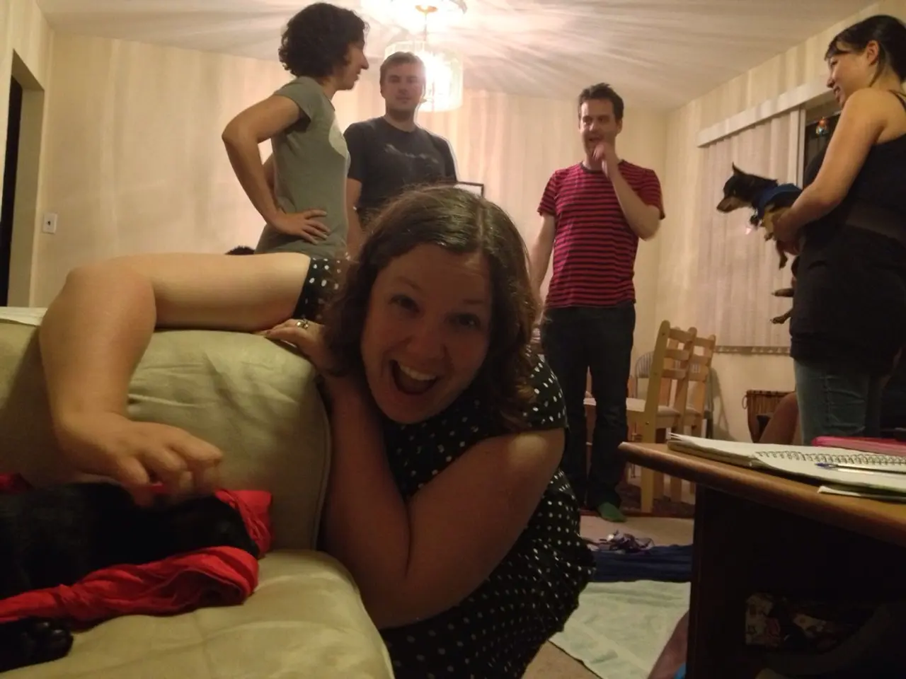 In this there are five people of which three are women and two are men. The woman in the front is...