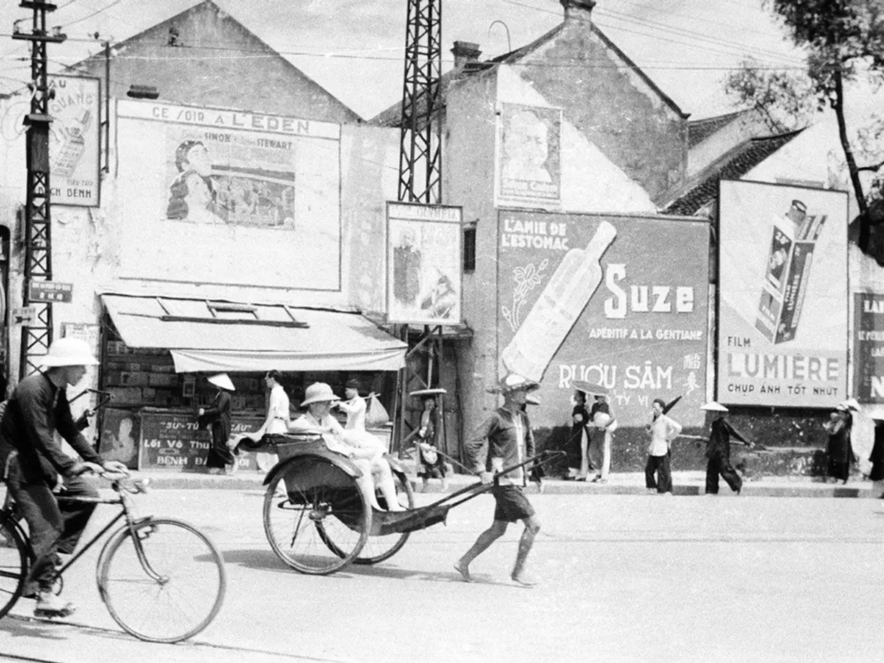 As we can see in the image there is a sky, current pole, house, banner, few people here and there....