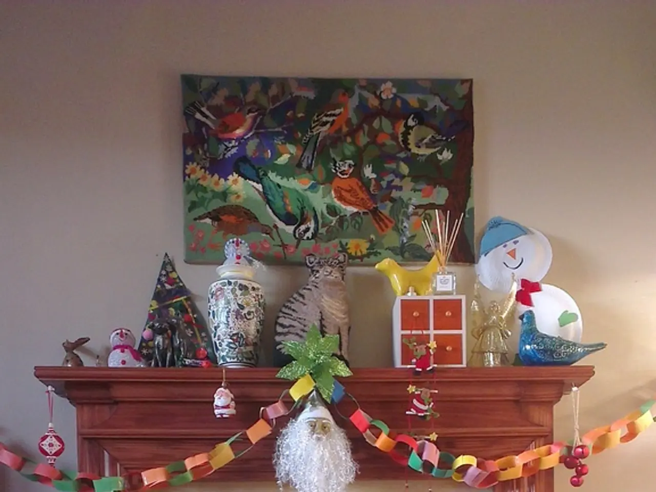 In this image in the center there is cat. In the background there are toys, there is a stand and on...