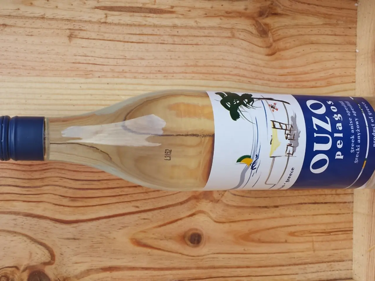 This bottle is highlighted in this picture. It has a blue cap.