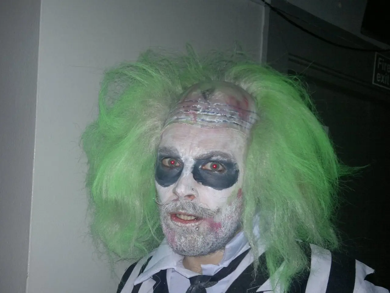 This image consists of a man wearing a costume. It looks like a halloween. In the background, we...