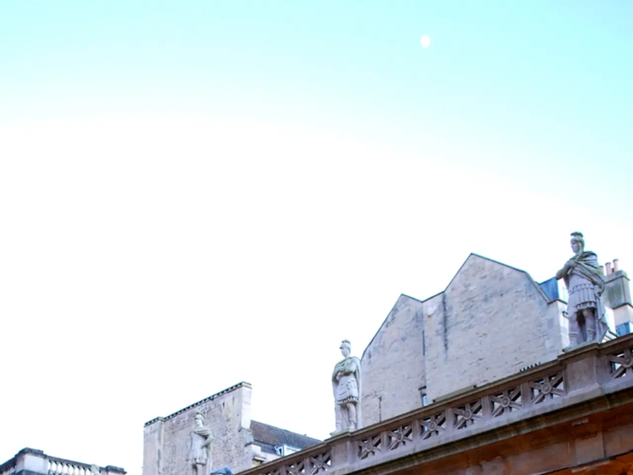 In this image I can see the water. In the background I can see the building with pillars. I can see...