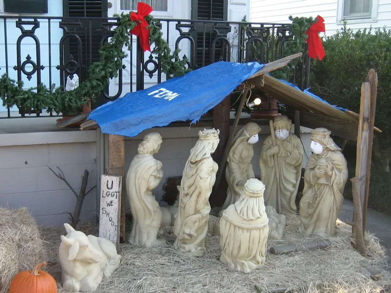 In this image there are statues under the tent. There is a pumpkin. At the bottom of the image...