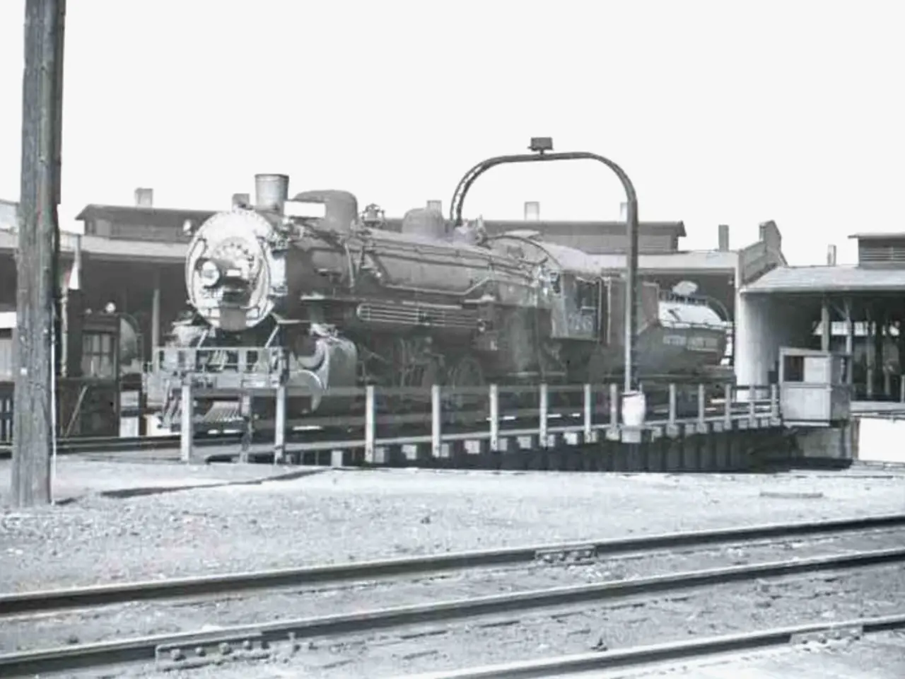 In this picture we can see a train in the middle of the image, and we can find few tracks,...