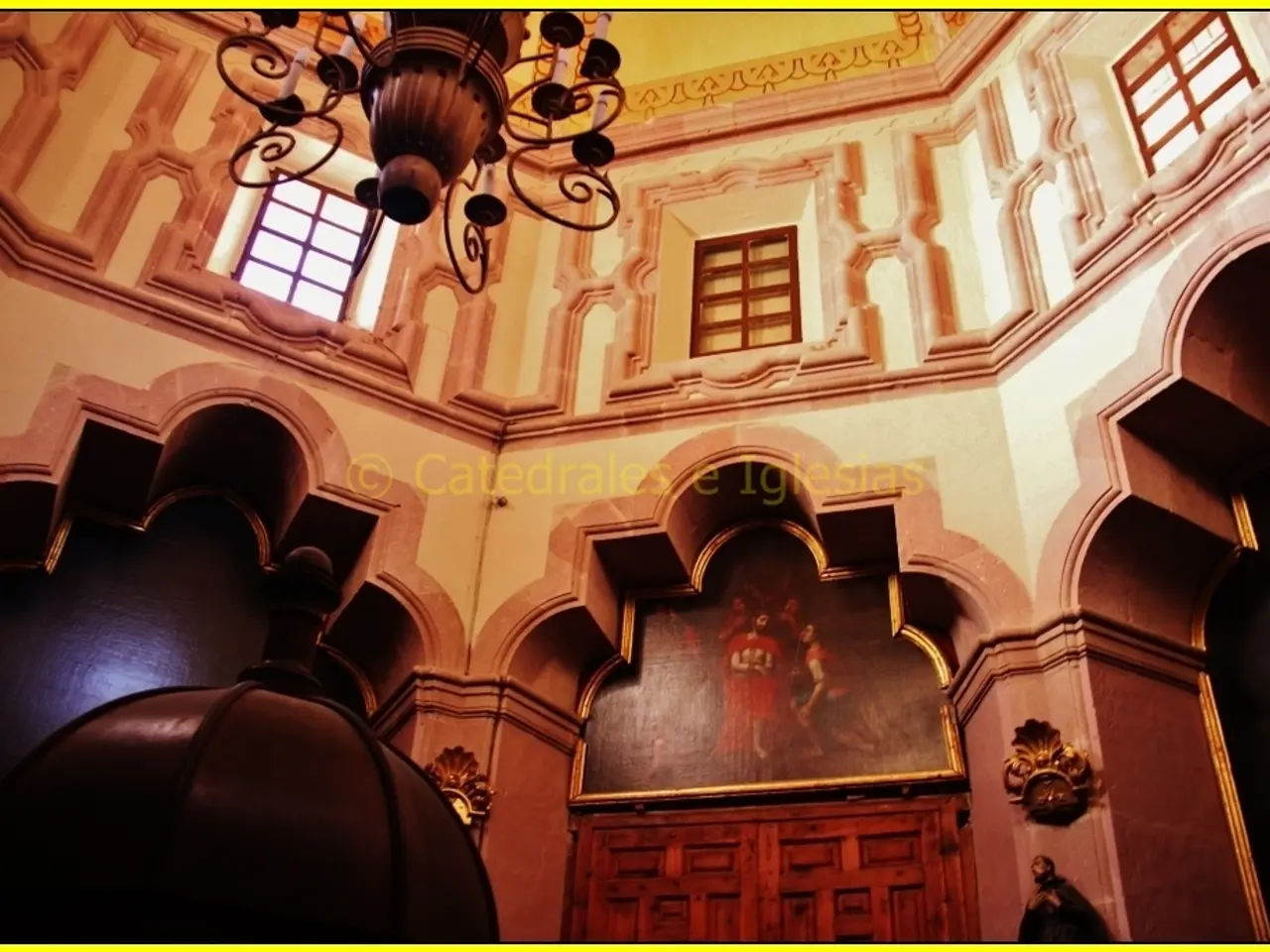 This is clicked inside a building, there is a photograph in the front above the door and there is a...