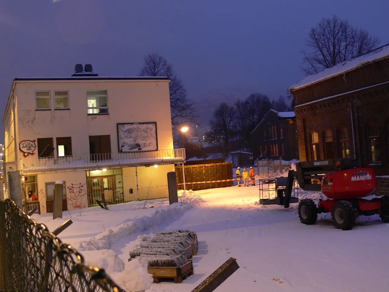Land is covered with snow. Here we can see a vehicle with wheels on the snow. Background there are...