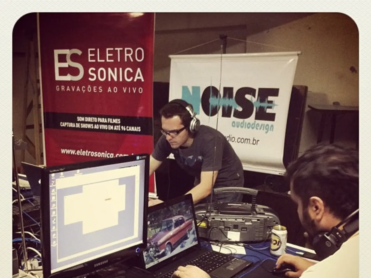 On this table there is a monitor, laptops, printer, keyboard, mouse, and, headset, device and...