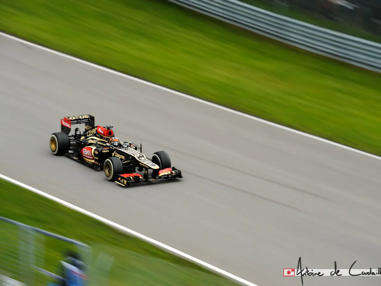 On the bottom right, there is a watermark. On the left side, there is a vehicle on the road. On...