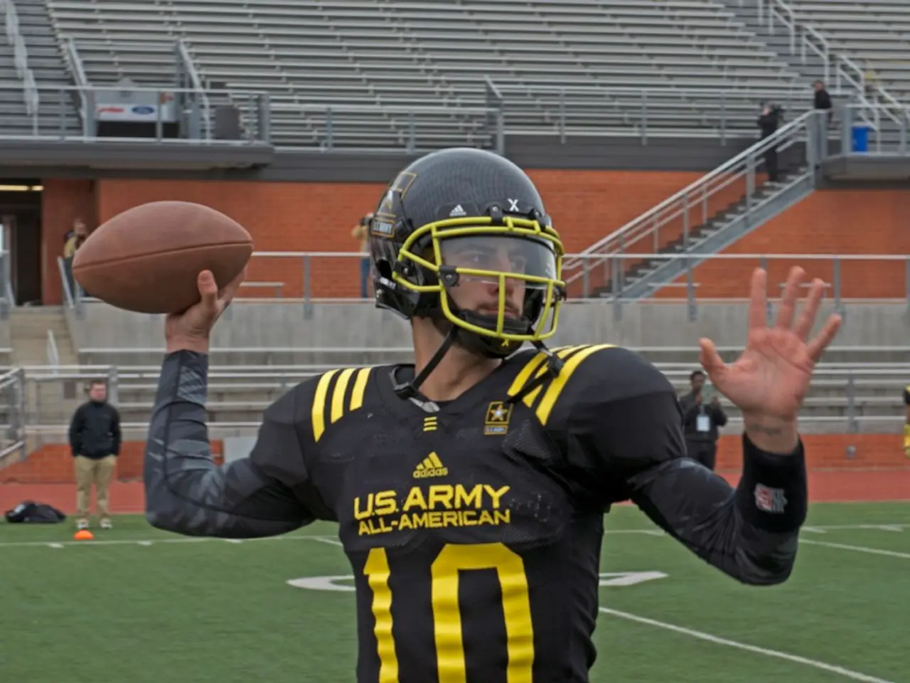 In this picture we can observe a rugby player wearing black color dress and a helmet on his head....