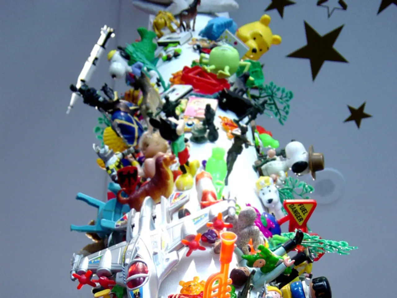 In the image to the wall there are many toys. At the right top of the image on the wall there are...