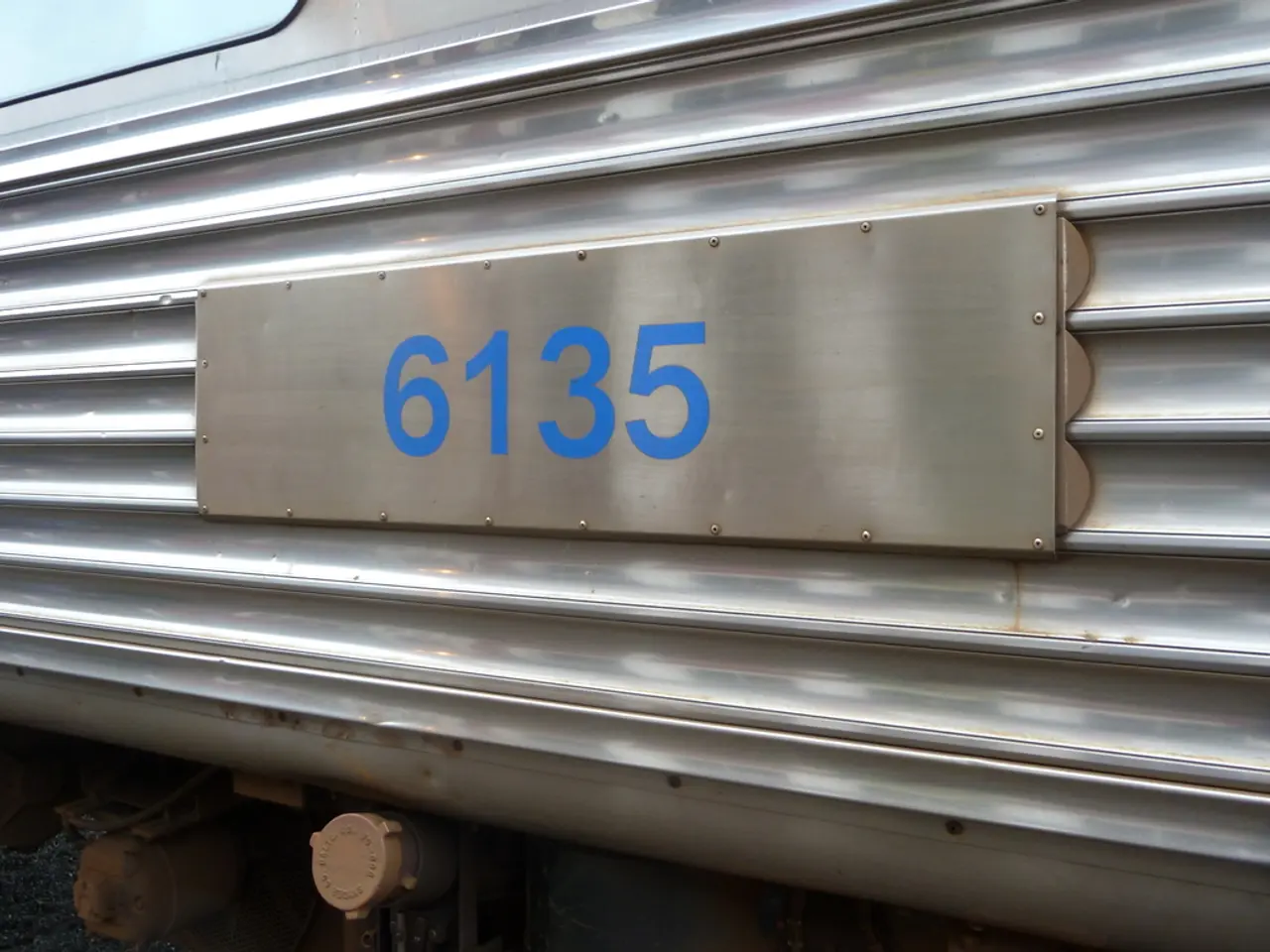 In this image we can see there is a number plate on the vehicle.