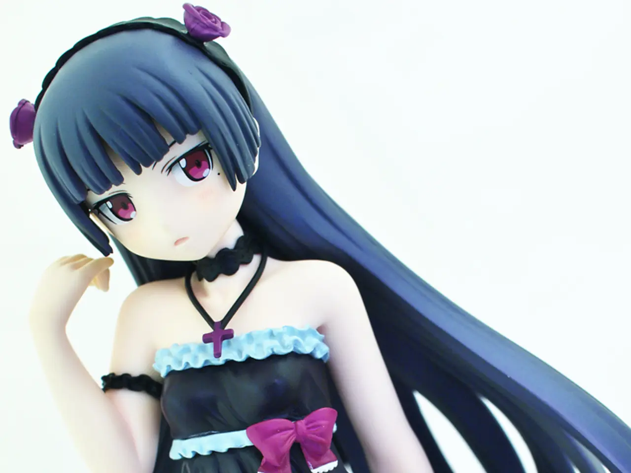 In this image there is a doll. In the background of the image it is in white color.