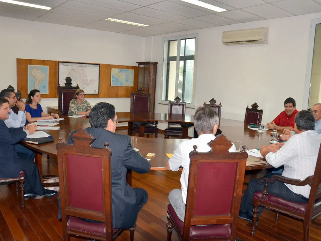 This picture describes about group of people they are all seated on the chair, in front of them we...