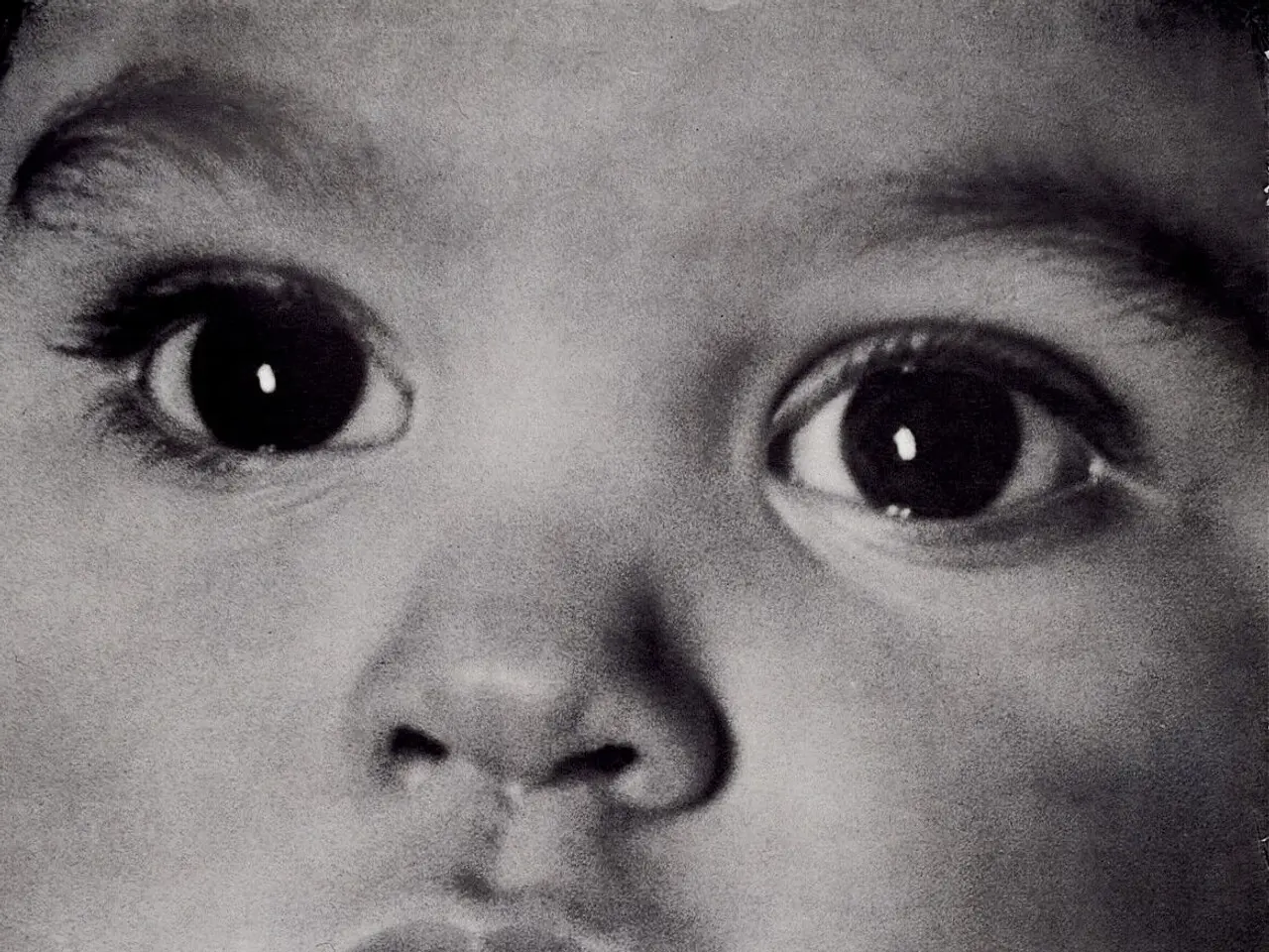 The image shows a poster with a child's face in the center, surrounded by text that reads "Every...