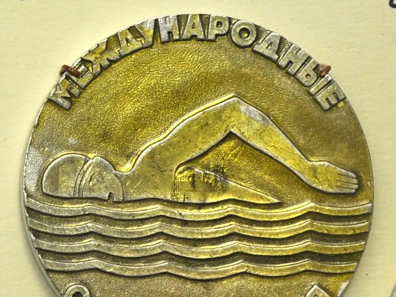 The image shows a gold medal with a picture of a man swimming in the water and text inscribed on...