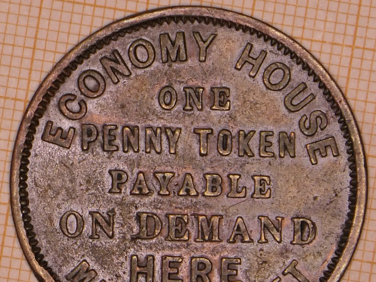 The image shows a coin with the words "Economy House One Penny Token Payable on Demand Here"...