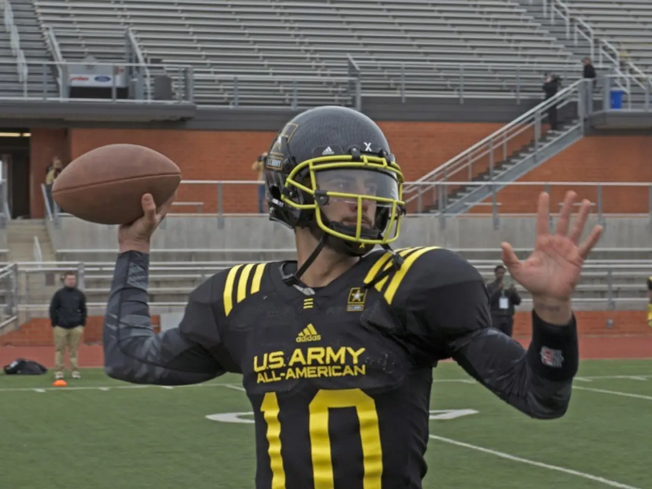 In this picture we can observe a rugby player wearing black color dress and a helmet on his head....