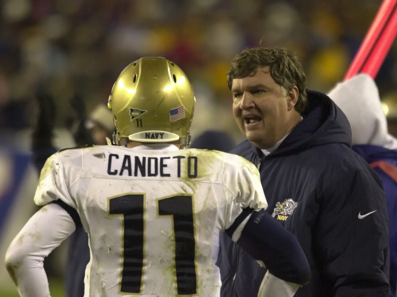 The image shows Notre Dame head coach Brian Kelly and quarterback Drew Brees standing together....