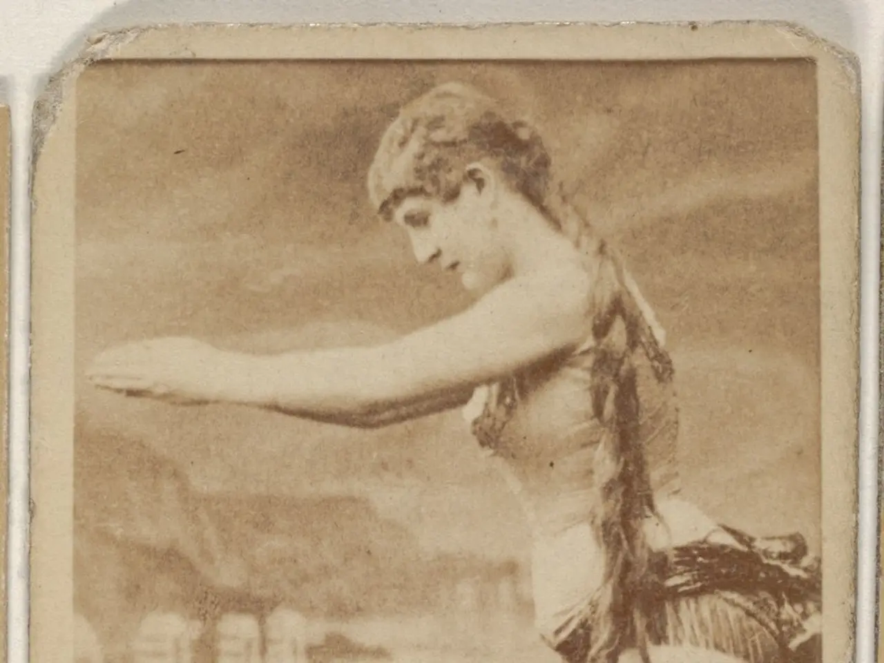 The image shows an old photo of a woman in a bikini standing on the beach, with text at the bottom...