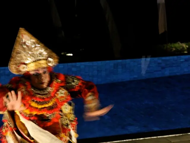 A person is running, this person wore garlands, crown and different clothes.