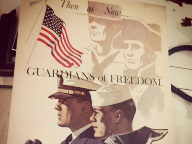 In the image there is a poster with two people, flag and something written on it. At the right...