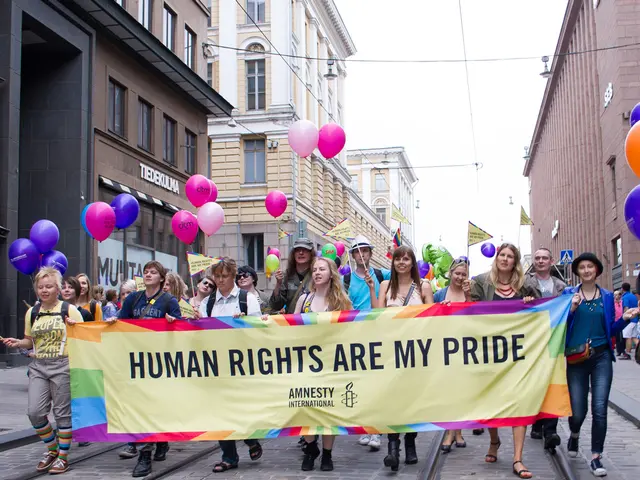 In this image in the center there are a group of people who are holding balloons, flags, board and...