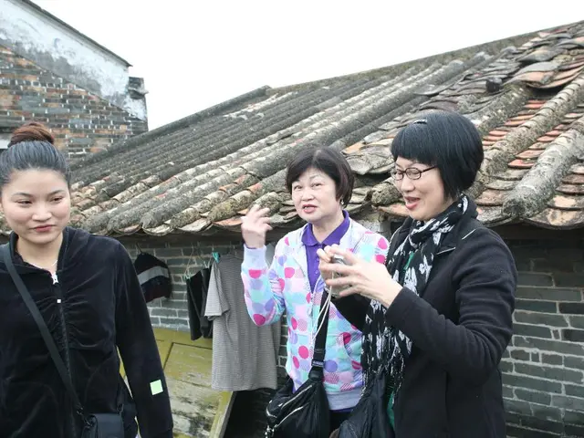 In this picture I can observe three women. Two of them are smiling. One of them is wearing...