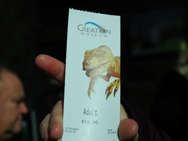 In the image we can see there is a card in the hand of a person on which there is a picture of...