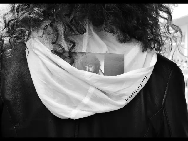 In this image we can see a person wearing a jacket.