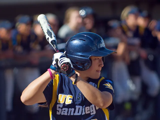 In this image we can see a group of people standing. There is a fencing in the image. A person is...