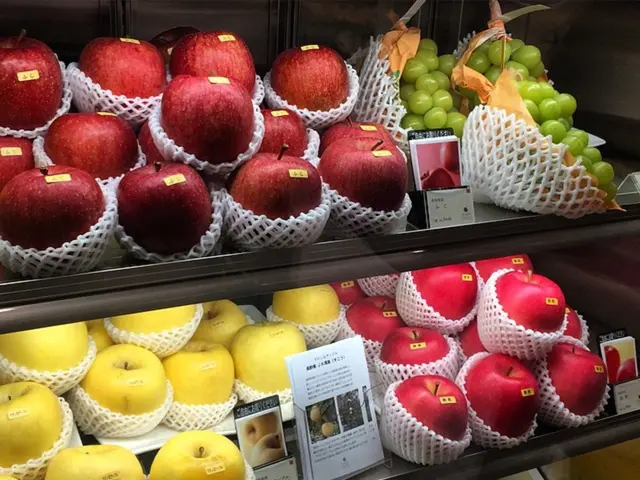 These are the red apples, beside there are grapes. These are the grapes at the down side of an...