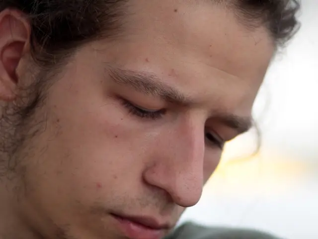 In this picture we can see the face of a person.