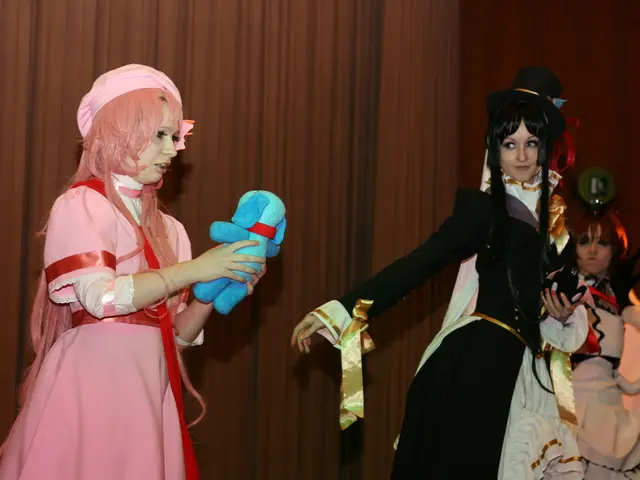 In this picture there are three women doing the drama. In the front there is a girl wearing pink...