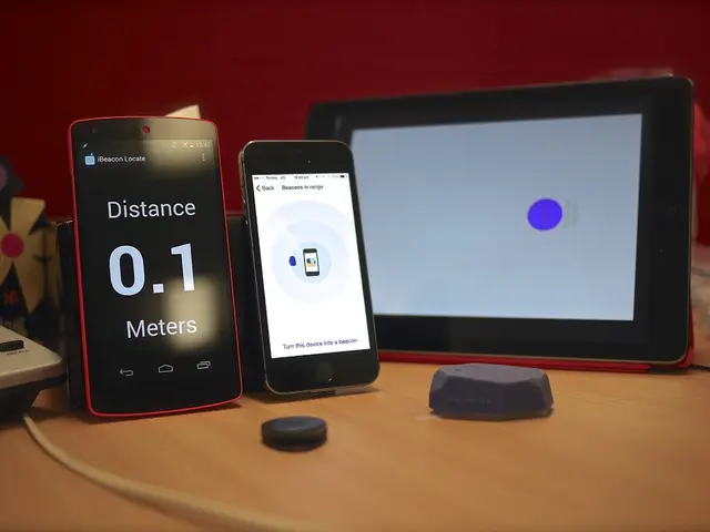 In this picture there are two cell phones on the left side of the image and there is a tablet in...