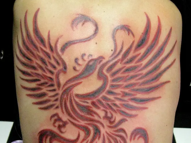 There is a tattoo on a human body as we can see in the middle of this image.