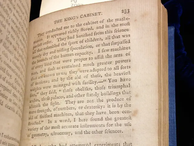 In this image we can see that there is a book which is opened. In the book there is some script. A...