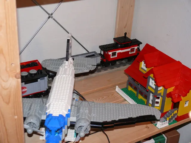 In this image, I can see the LEGO puzzle toys. I can see a train, airplane and a house, which are...